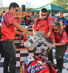 Students building an auto engine